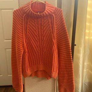 Free people slouchy sweater. Faded orange color.  Size small